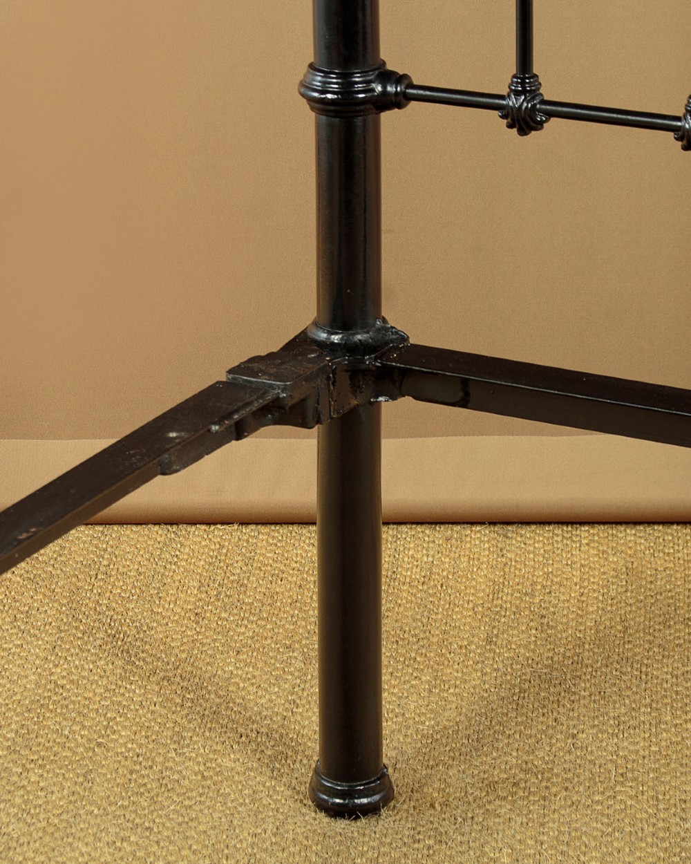 A late Victorian black iron and brass king-size bed frame featuring decorative brass finials, a dipped brass top rail, and vertical spindles. View XI