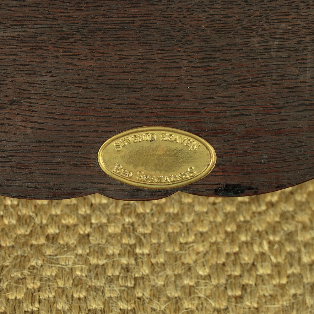 A c.1920 French-style upholstered day bed featuring a dark carved wooden frame, terracotta red patterned fabric, and matching tassel-trimmed cushions. View XII