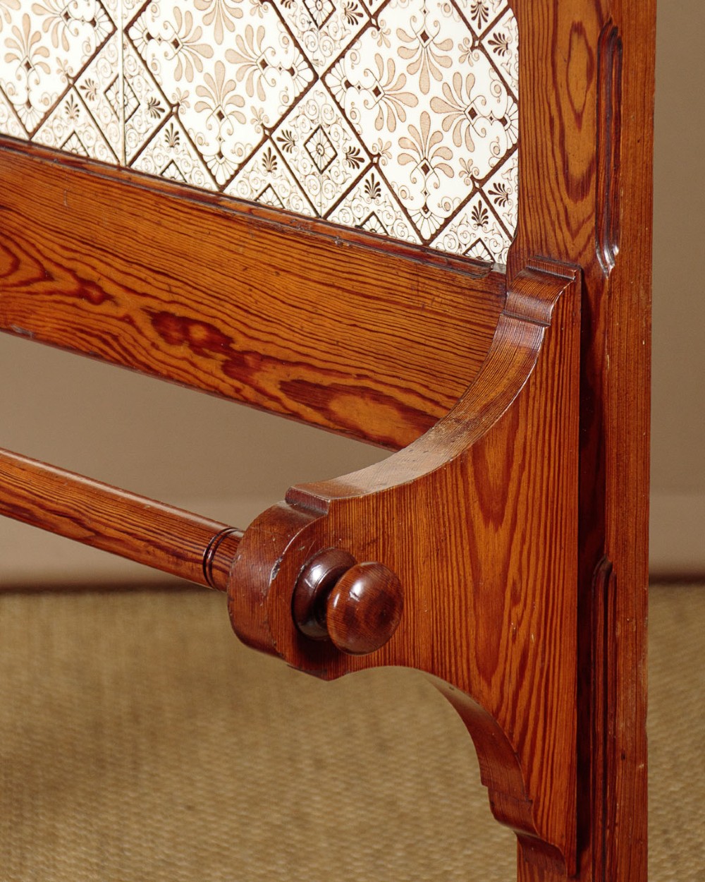 A large Victorian pine hallstand featuring a central vertical mirror, multiple brass coat hooks, inset ceramic tiles, a marble-topped glove drawer, and lower umbrella stand trays. View X