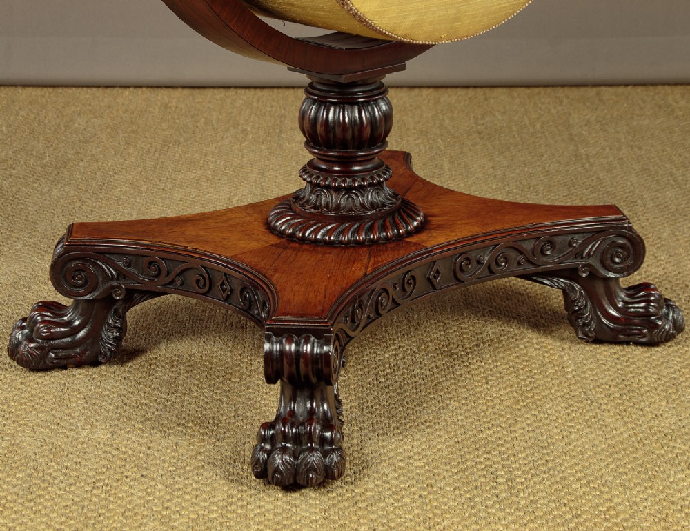 A nineteenth-century rosewood Pembroke side table with drop-leaf sides, a fabric work basket, turned column, and carved scroll feet. View VIII