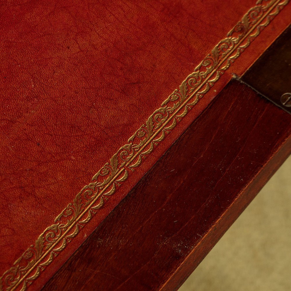 An 1830 mahogany secretaire abattant featuring a white marble top, brass-mounted fluted side columns, a drop-front writing panel, and a double-door cupboard. View IX