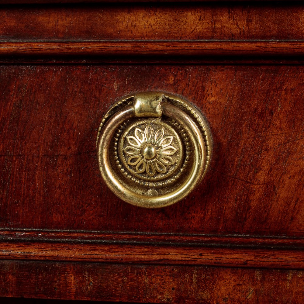 A Victorian flame mahogany chiffonier cabinet featuring frieze drawers with brass ring pulls and twin panelled cupboard doors on a plinth base. View VIII