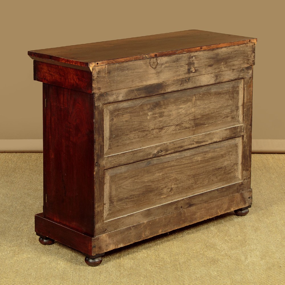 A Victorian flame mahogany chiffonier cabinet featuring frieze drawers with brass ring pulls and twin panelled cupboard doors on a plinth base. View XII