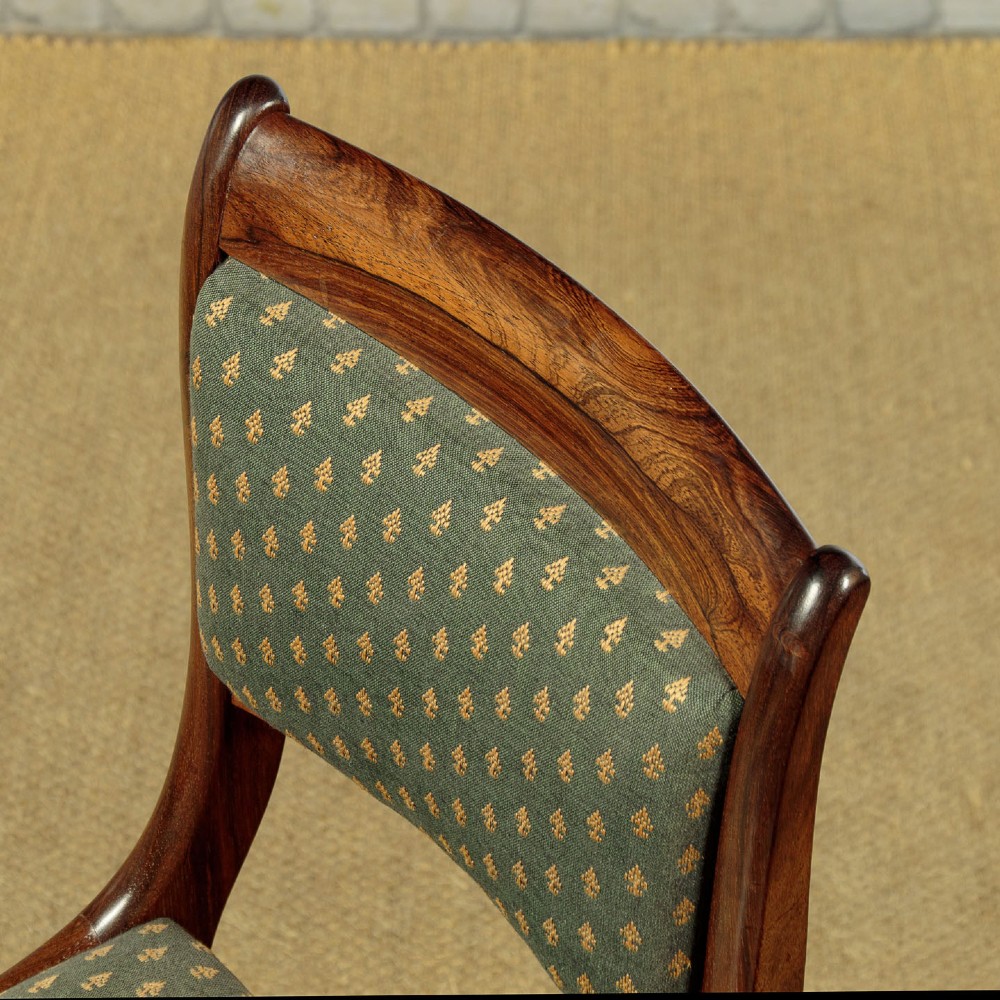 Set of six late Regency rosewood dining chairs featuring reeded front legs, sabre rear legs, and green patterned fabric upholstered seats and back panels. View VI
