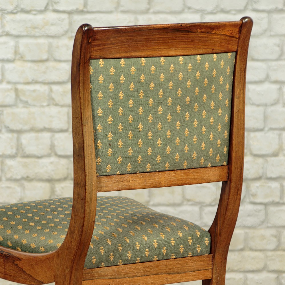 Set of six late Regency rosewood dining chairs featuring reeded front legs, sabre rear legs, and green patterned fabric upholstered seats and back panels. View XIII