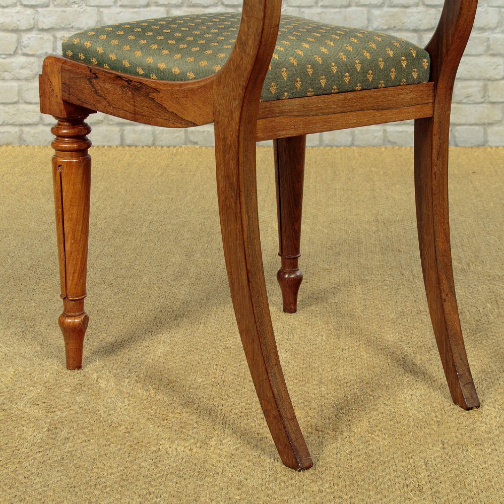 Set of six late Regency rosewood dining chairs featuring reeded front legs, sabre rear legs, and green patterned fabric upholstered seats and back panels. View XIV