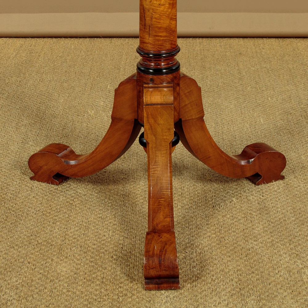 A tall Victorian turned walnut hall tree featuring multi-tiered pegs on a central column supported by a carved four-legged base. View VIII
