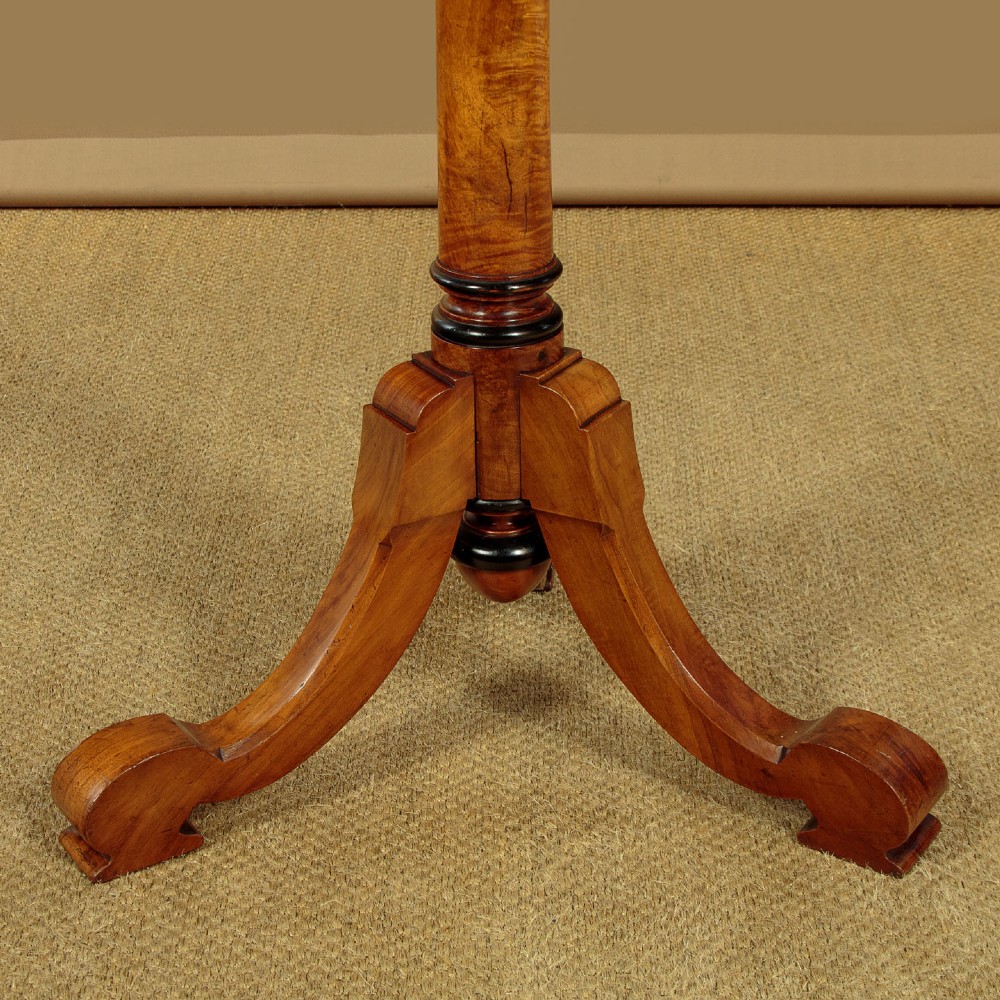 A tall Victorian turned walnut hall tree featuring multi-tiered pegs on a central column supported by a carved four-legged base. View IX