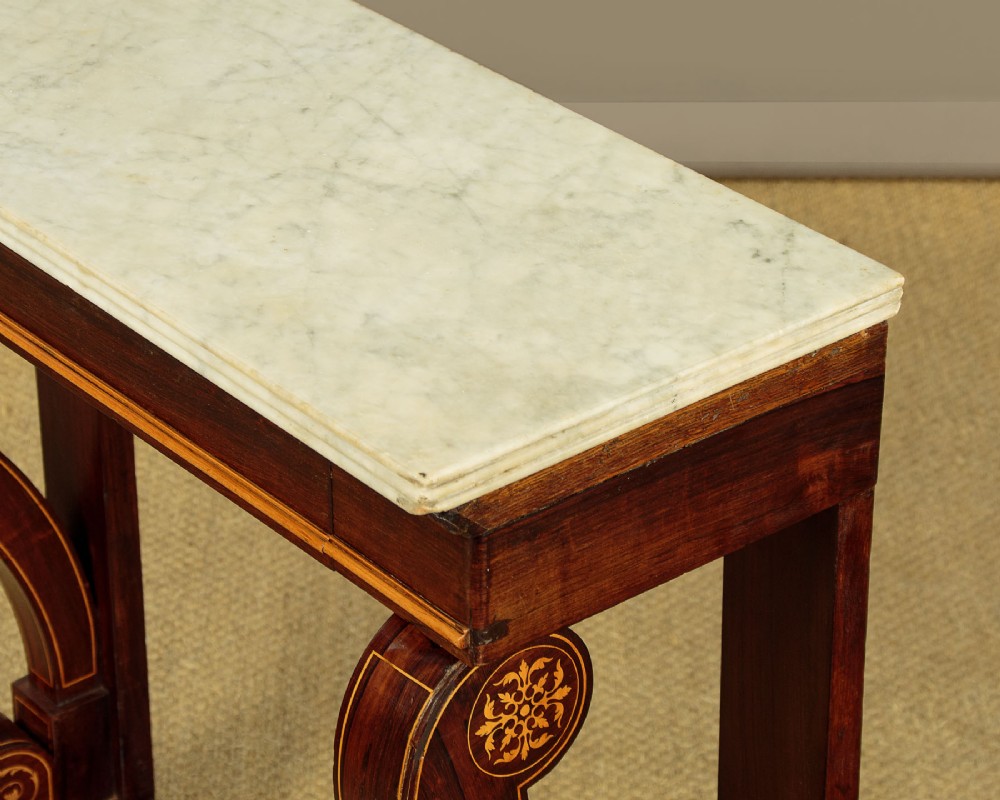A small late Victorian mahogany console table featuring a white marble top, decorative marquetry on curved scroll legs, a single frieze drawer, and a solid plinth base. View VI