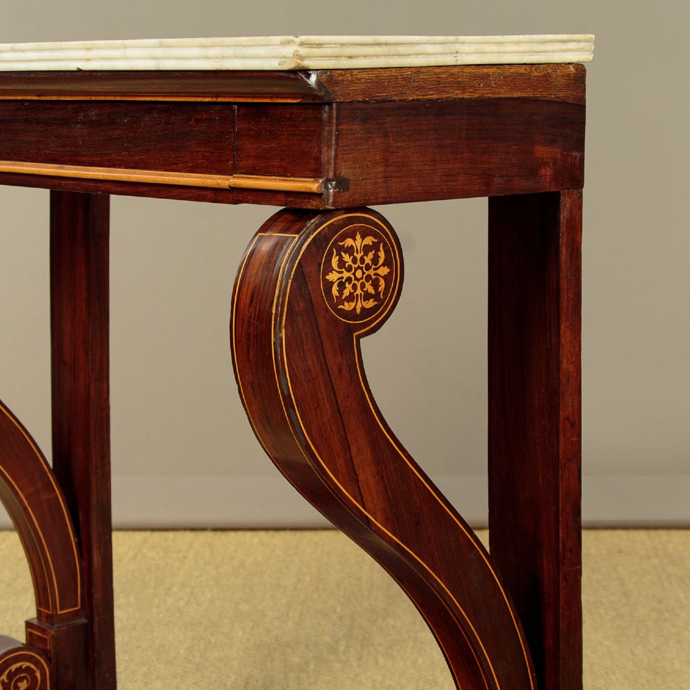 A small late Victorian mahogany console table featuring a white marble top, decorative marquetry on curved scroll legs, a single frieze drawer, and a solid plinth base. View VII