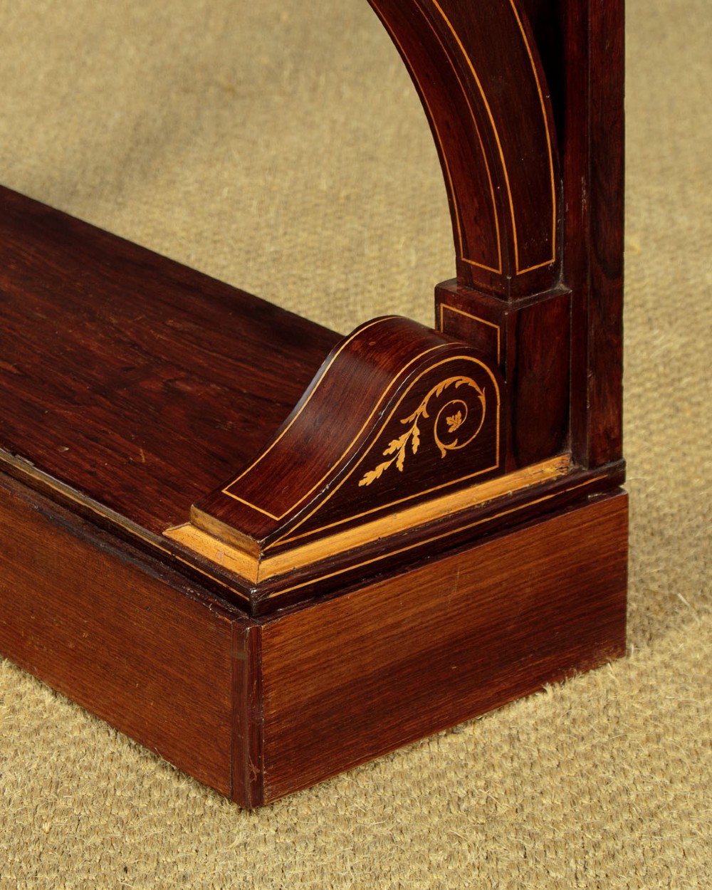A small late Victorian mahogany console table featuring a white marble top, decorative marquetry on curved scroll legs, a single frieze drawer, and a solid plinth base. View IX