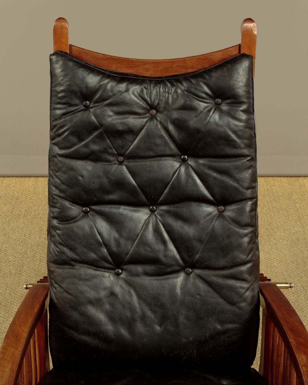 An Arts and Crafts adjustable reclining armchair in polished hardwood with slatted side panels and dark brown tufted leather cushions. View VI