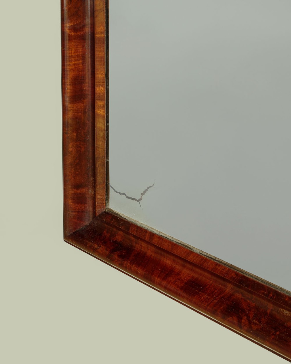 A tall and narrow 19th-century dark mahogany pier mirror featuring a carved Gothic arch cresting and moulded side pillars. View IX