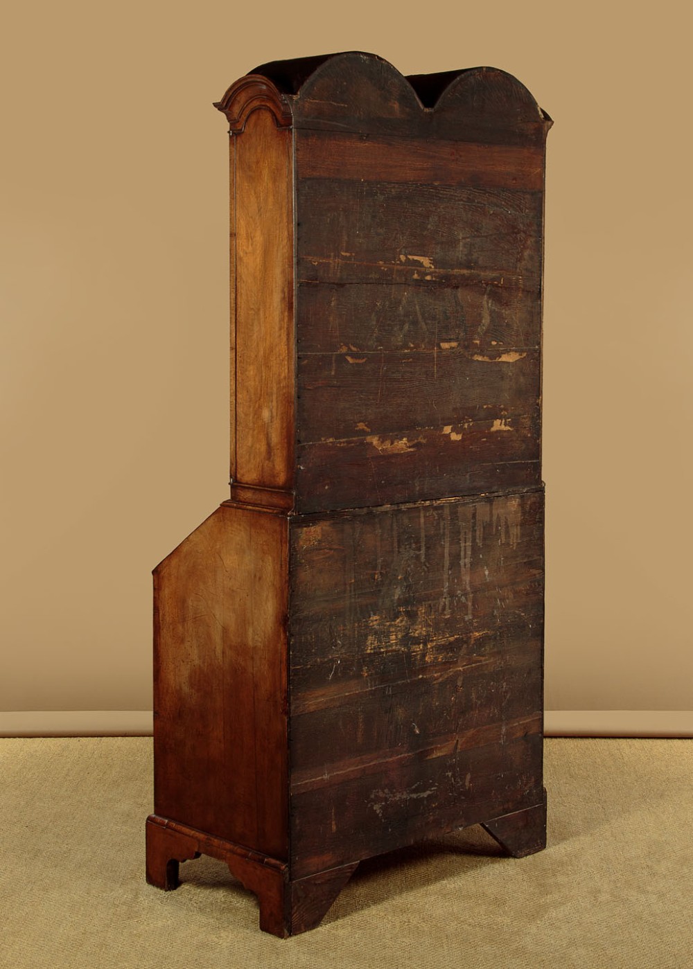 A Queen Anne style burr walnut bureau cabinet featuring a double-domed top with twin mirrored doors above a slant-front writing slope and lower drawers. View XV