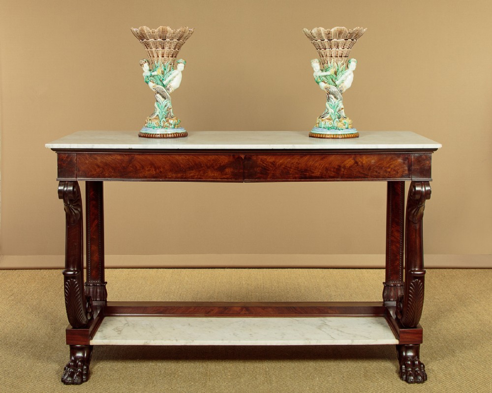 A 19th-century mahogany console table with a white marble top, lower marble tier, carved scroll legs, and paw feet. View II