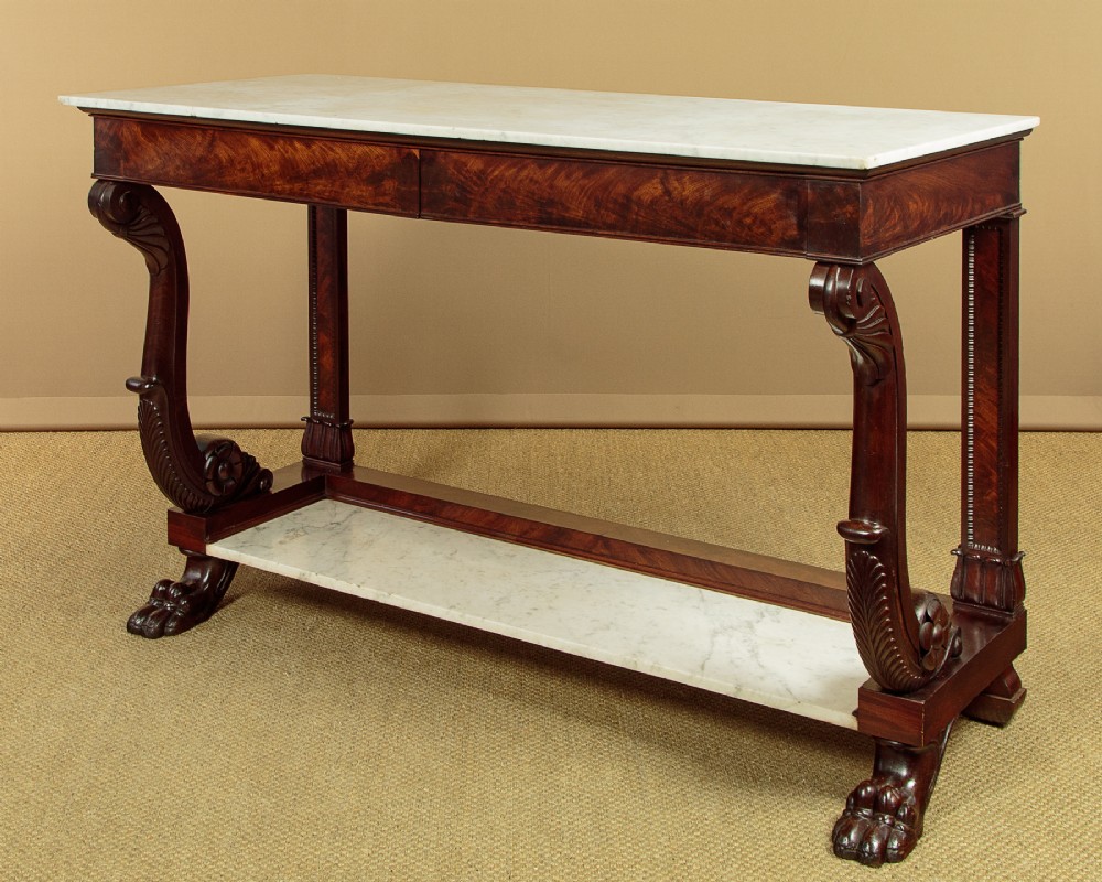 A 19th-century mahogany console table with a white marble top, lower marble tier, carved scroll legs, and paw feet. View III