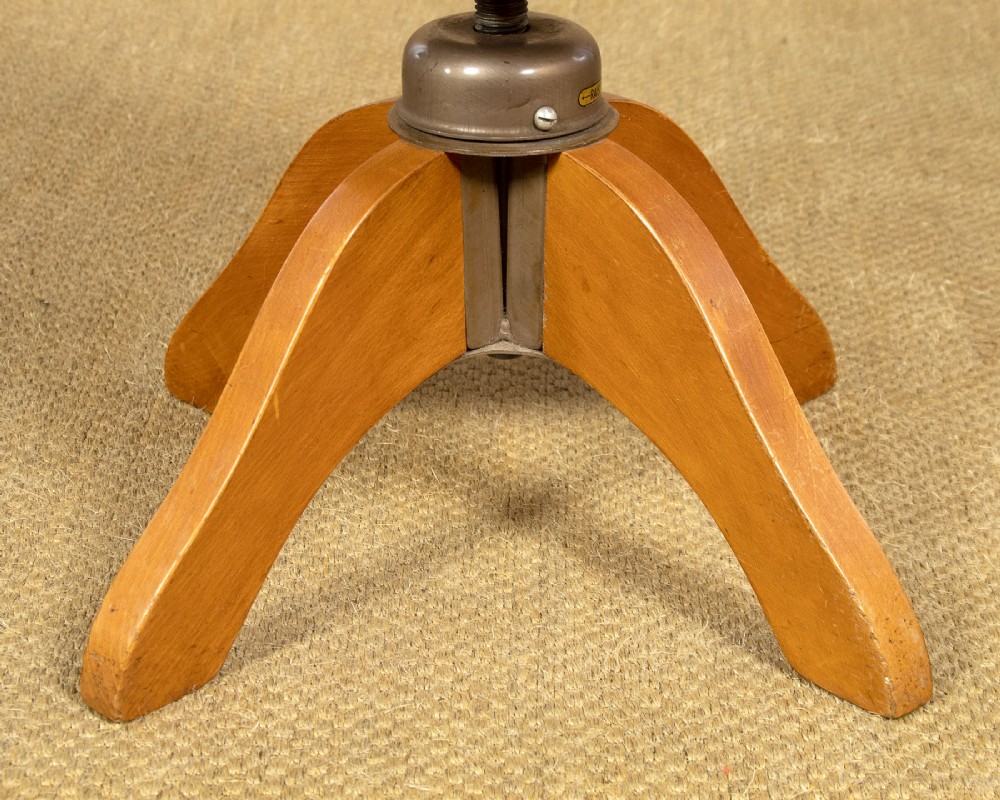 An Art Deco light oak dressing table featuring a central oval mirror, stepped drawer pedestals, and a clear glass surface. View XII