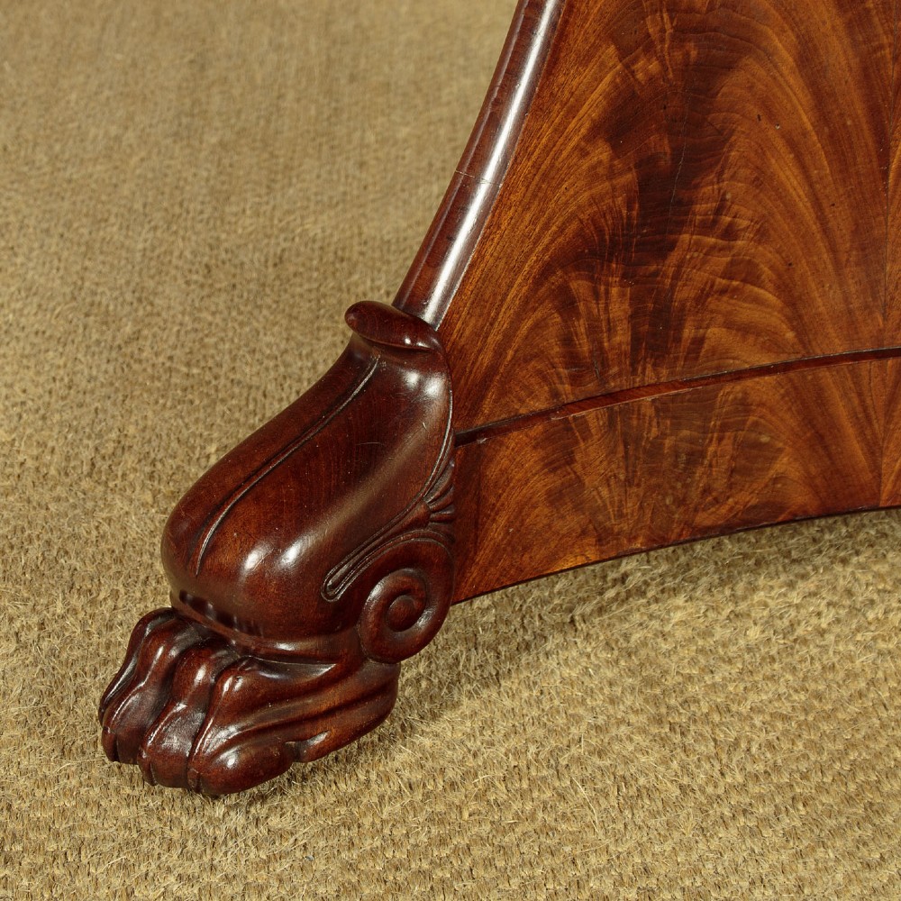 A circular antique mahogany gueridon centre table featuring a dark grey marble top, a flared central pedestal, and carved paw feet. View VIII