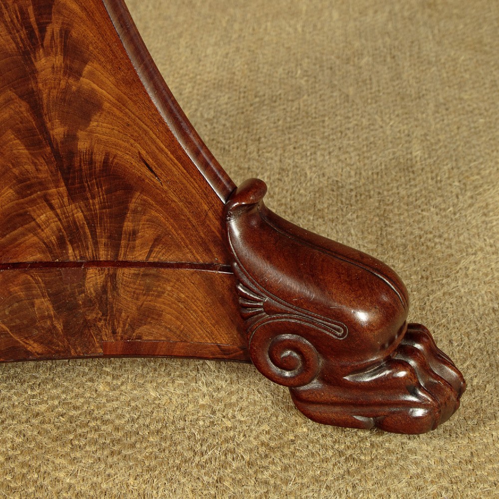 A circular antique mahogany gueridon centre table featuring a dark grey marble top, a flared central pedestal, and carved paw feet. View IX