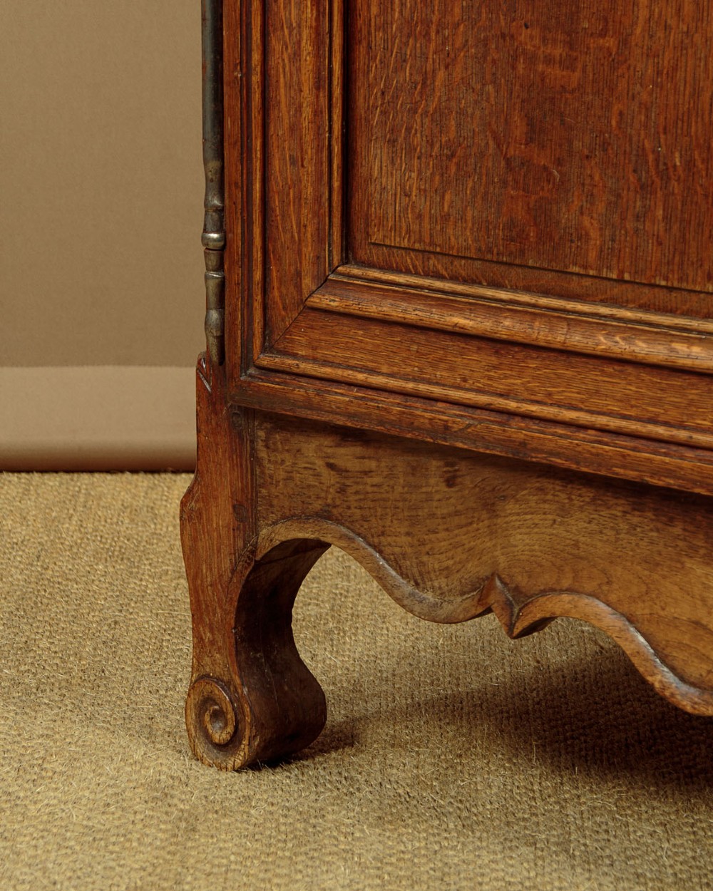 An 18th-century French provincial oak housekeepers cupboard featuring two upper and two lower moulded panel doors with carved star motifs and cabriole feet. View XII
