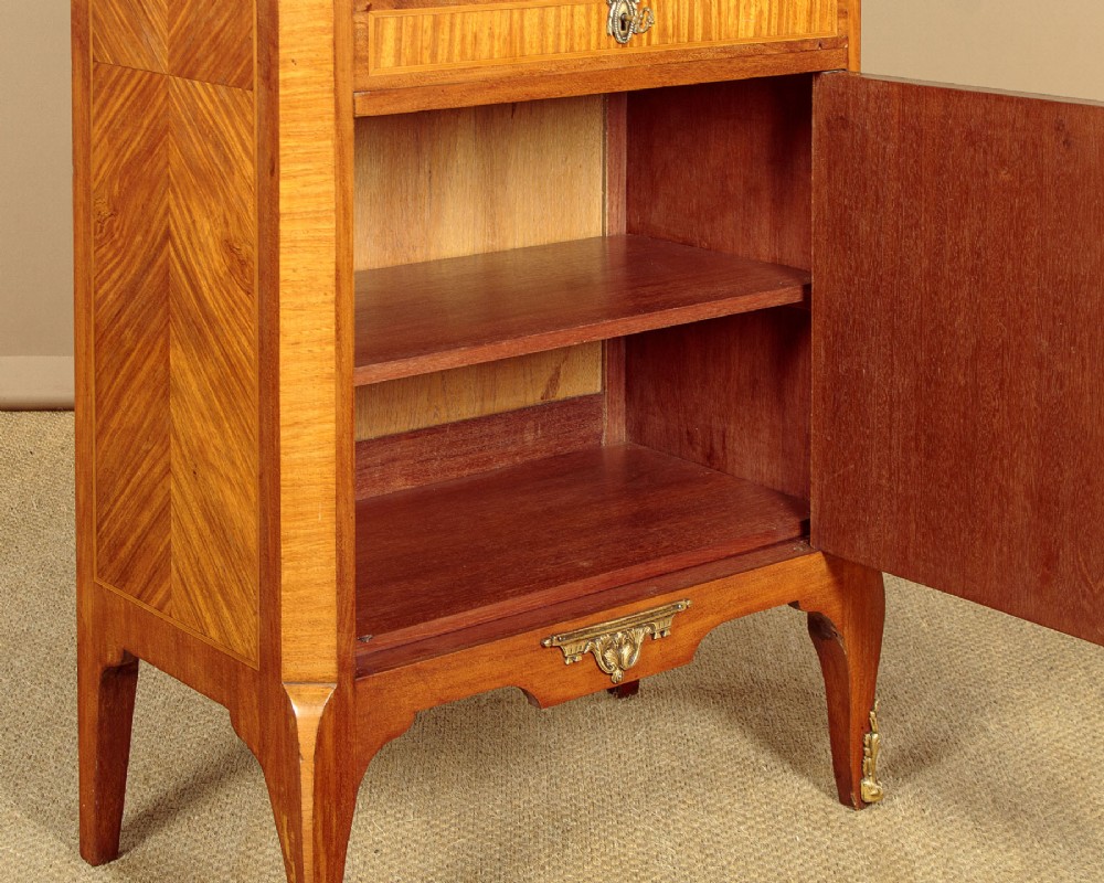 A tall Louis XVI style wooden side cabinet featuring geometric herringbone parquetry veneers, brass mounts, and a polished marble top. View XII