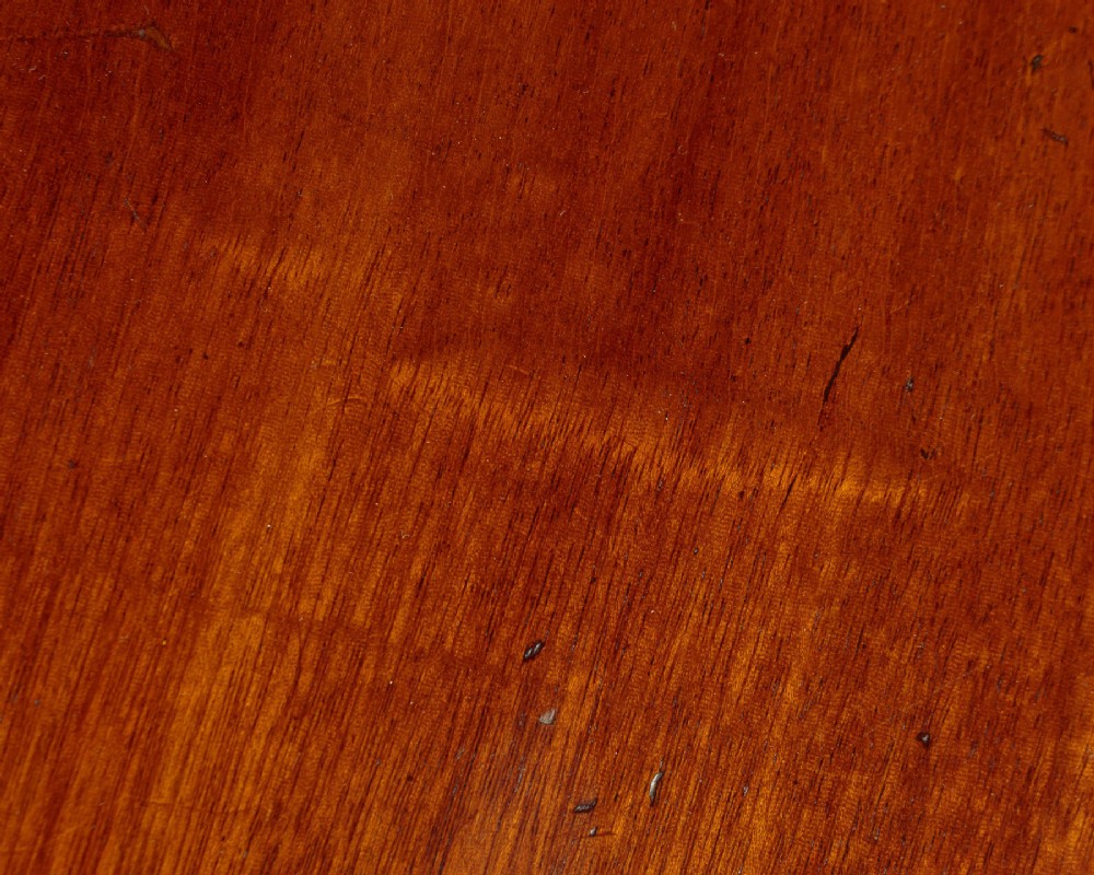 A large Victorian mahogany oval coffee table featuring a polished top, a deep apron, and a carved quadruped pedestal base with scroll feet. View VIII
