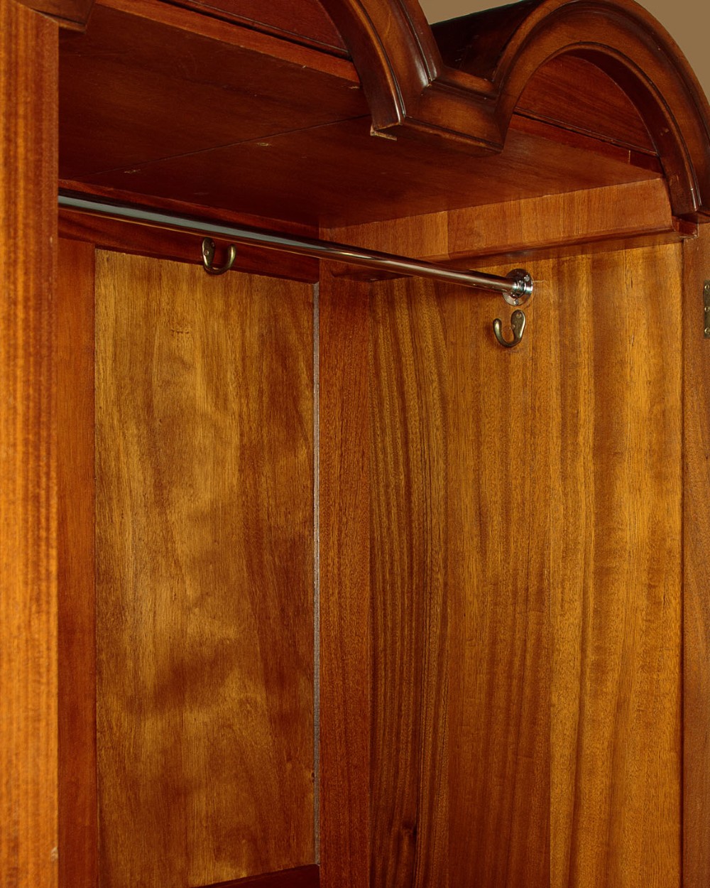 A 1920s Queen Anne style triple-door combination wardrobe made of figured burr walnut veneer with triple arched cornices and cabriole legs. View VI