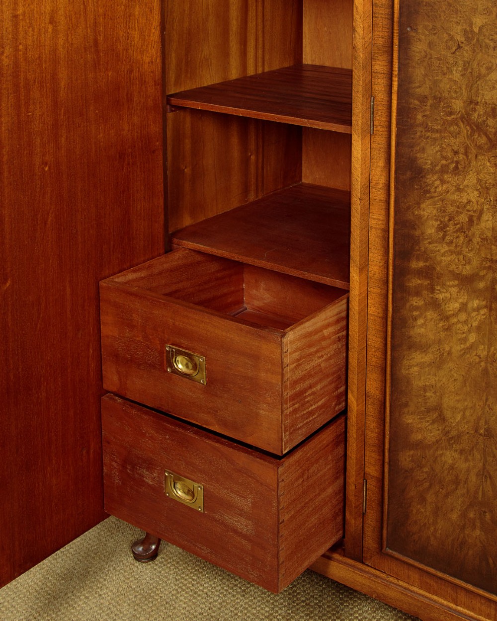 A 1920s Queen Anne style triple-door combination wardrobe made of figured burr walnut veneer with triple arched cornices and cabriole legs. View VII