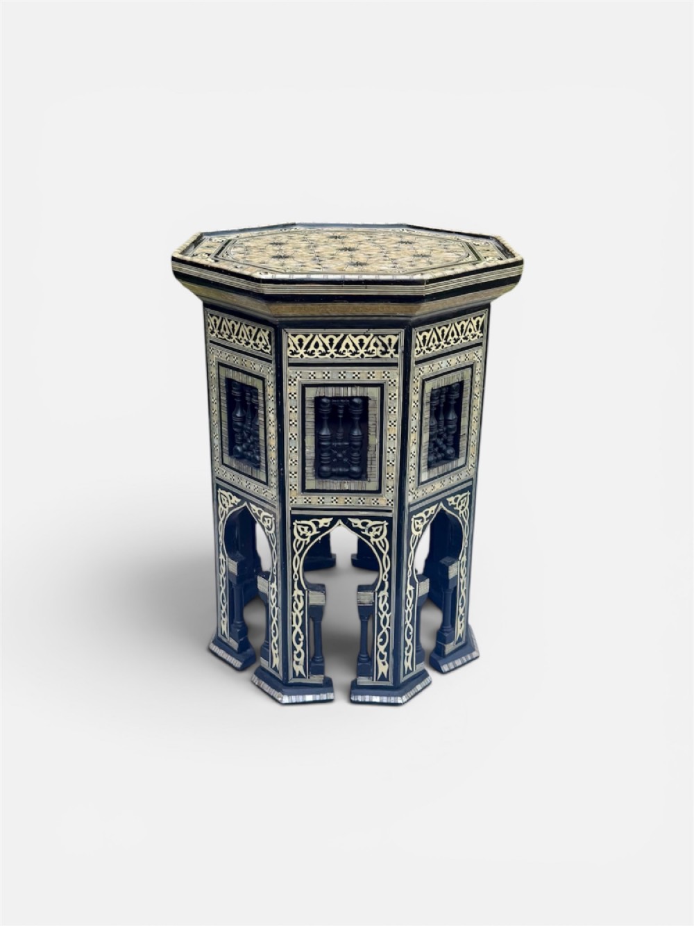 A 19th-century octagonal side table constructed from dark wood intricately inlaid with geometric mother-of-pearl star patterns and arched apron motifs. View II