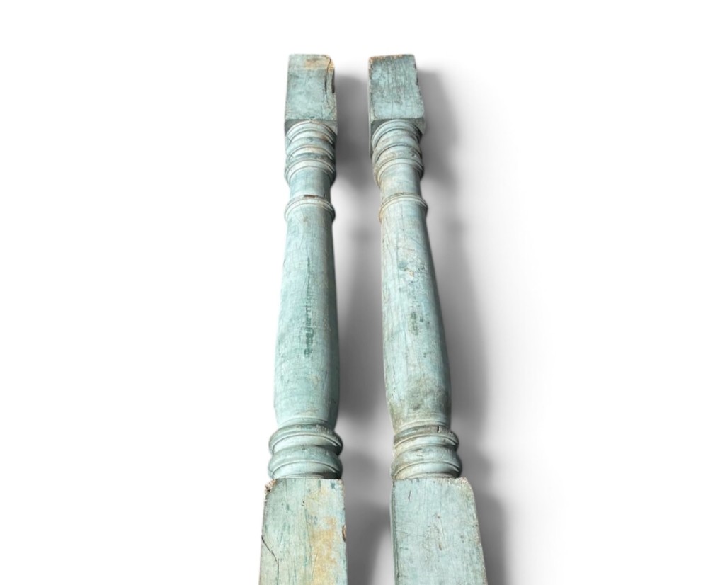 A pair of 19th-century turned hardwood architectural columns featuring a weathered blue-green painted finish. View III