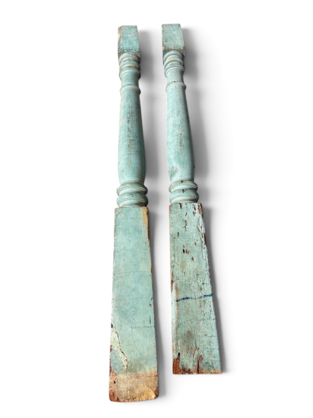 A pair of 19th-century turned hardwood architectural columns featuring a weathered blue-green painted finish. View IV