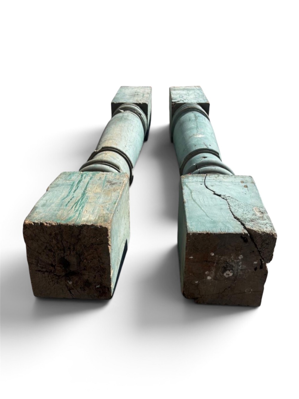 A pair of 19th-century turned hardwood architectural columns featuring a weathered blue-green painted finish. View VIII