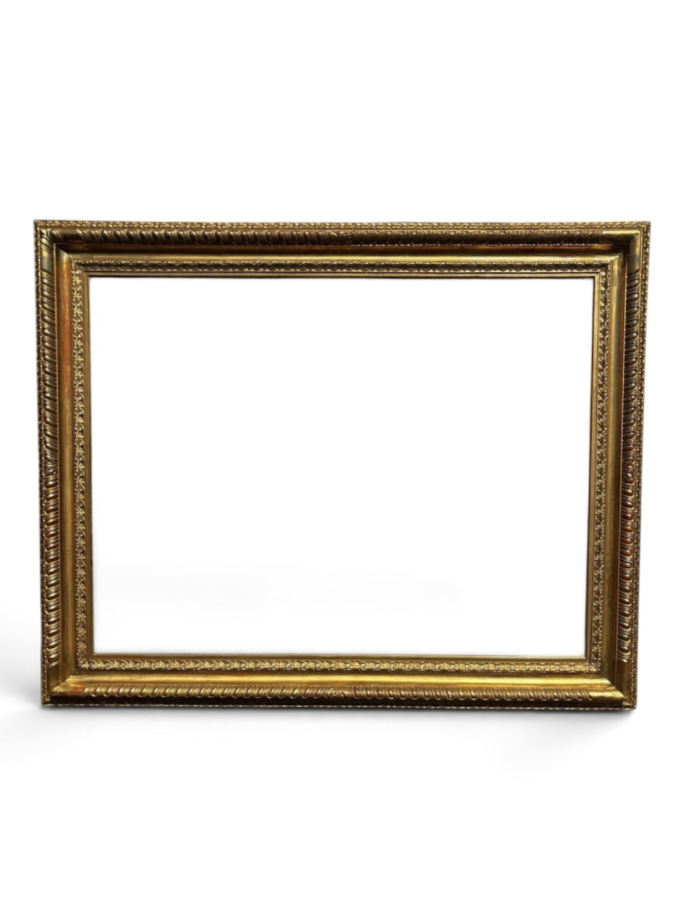 A rectangular 19th-century gilded wooden frame featuring detailed decorative moulding and a warm gold leaf finish.
