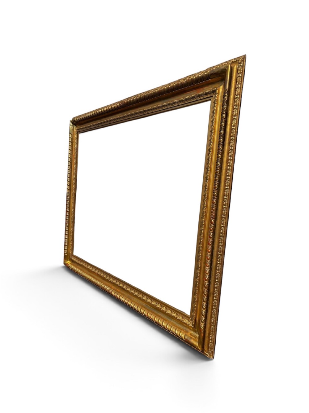 A rectangular 19th-century gilded wooden frame featuring detailed decorative moulding and a warm gold leaf finish. View II