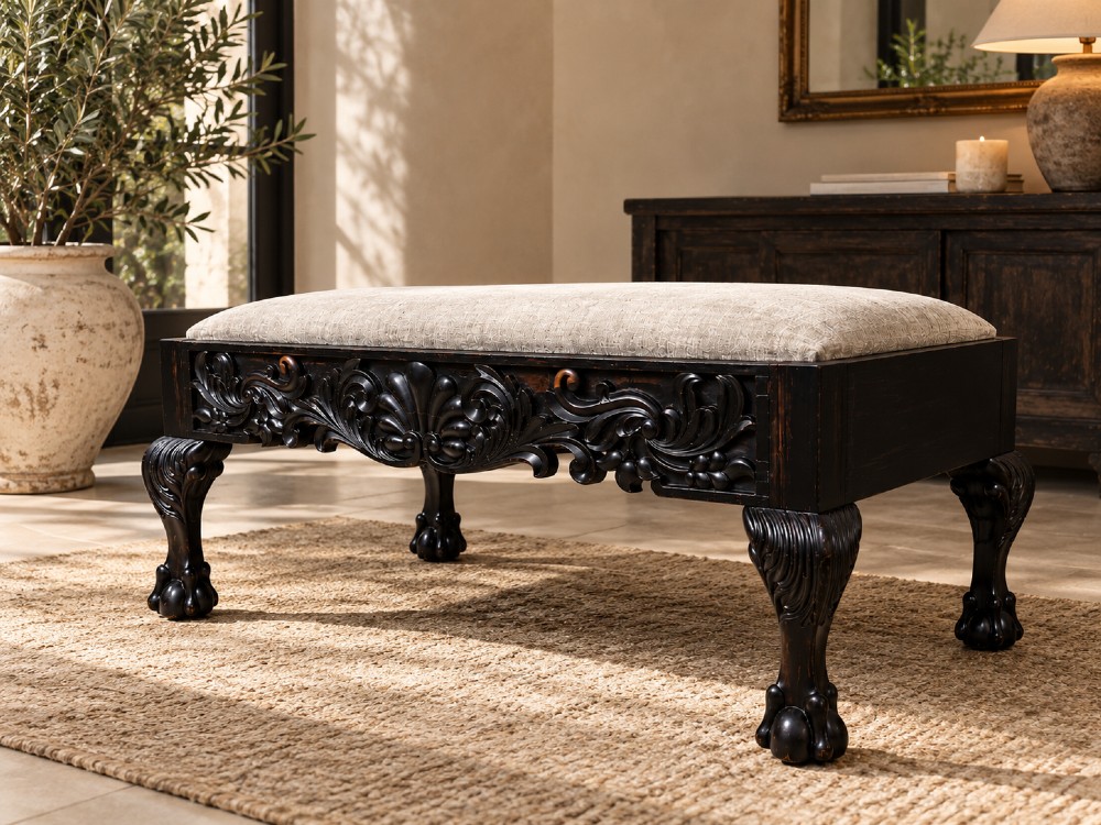 A 19th-century Ceylonese calamander wood stool featuring detailed floral relief carvings on the frame, cabriole legs with claw-and-ball feet, and neutral upholstered seat. View IV