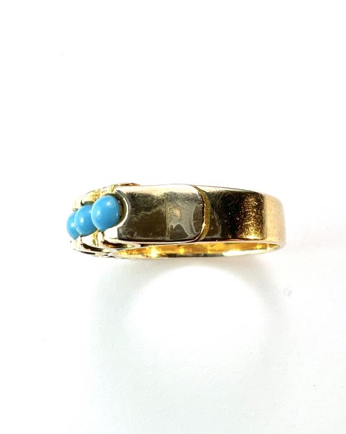 fig 1. An 18ct yellow gold modernist ring set with six round turquoise cabochons within a textured openwork gallery.