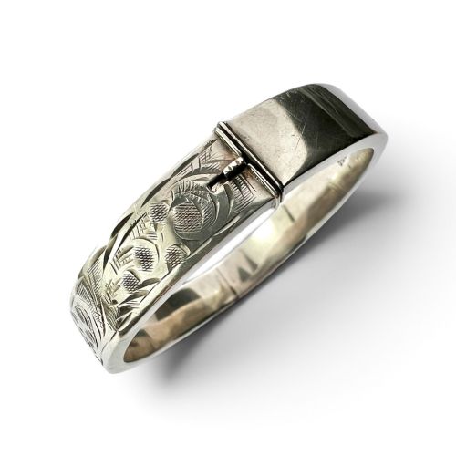 fig 1. A sterling silver hinged bangle decorated with engraved foliate motifs and visible internal makers hallmarks.