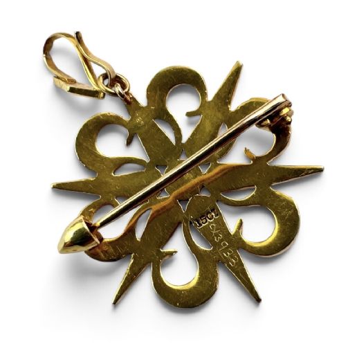 An antique 15ct yellow gold sunburst pendant brooch set with seed pearls arranged in a celestial starburst and scroll motif. View III