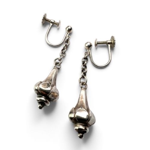 fig 1. A pair of sterling silver drop earrings featuring screw-back fastenings, chain links, and ribbed lotus bud pendants.