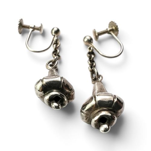 A pair of sterling silver drop earrings featuring screw-back fastenings, chain links, and ribbed lotus bud pendants. View III