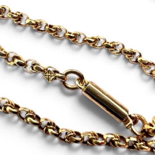 An Edwardian 9ct gold chain necklace coiled flat against a neutral white background displaying rope links and a cylindrical clasp. View V
