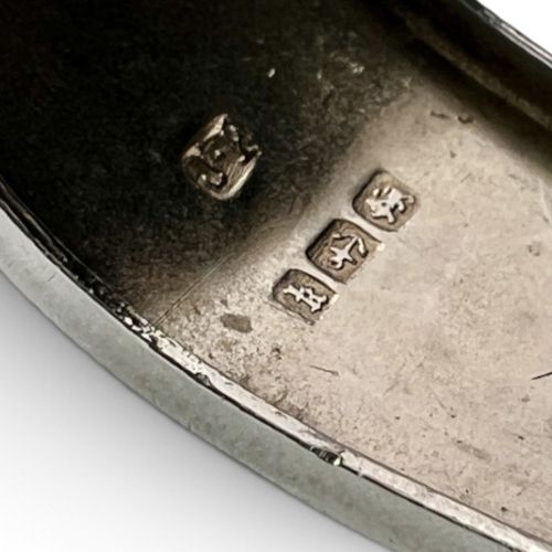 An antique Victorian sterling silver hinged bangle with hand-engraved floral and leaf motifs and interior hallmarks. View VIII