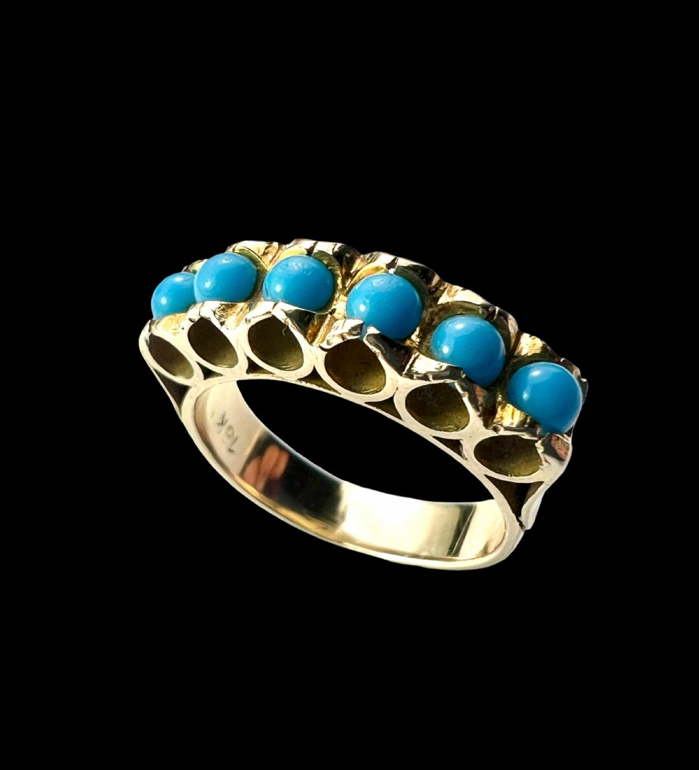 An 18ct yellow gold modernist ring set with six round turquoise cabochons within a textured openwork gallery. View III