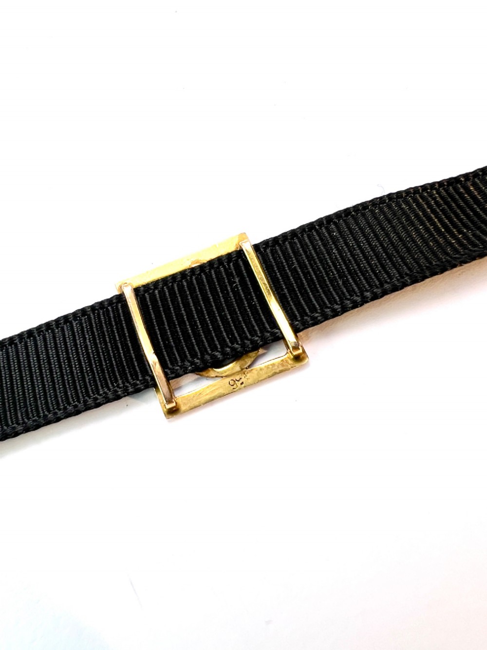 A square 9ct yellow gold Victorian ribbon slider pendant featuring a gothic letter E set with seed pearls. View VIII