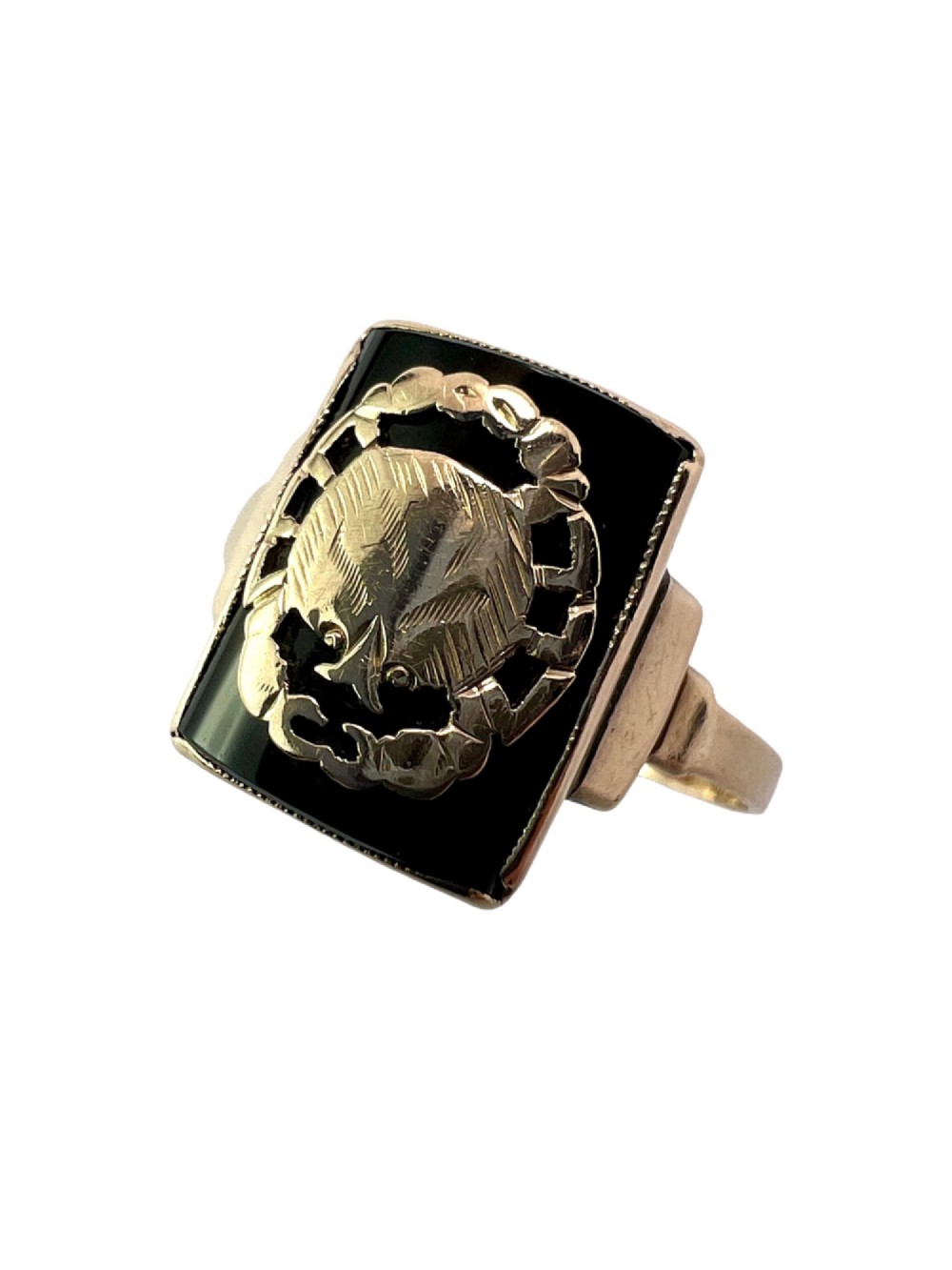 A rectangular 9ct gold ring set with a flat black onyx plaque featuring an detailed gold crab motif for the Cancer zodiac sign. View VI