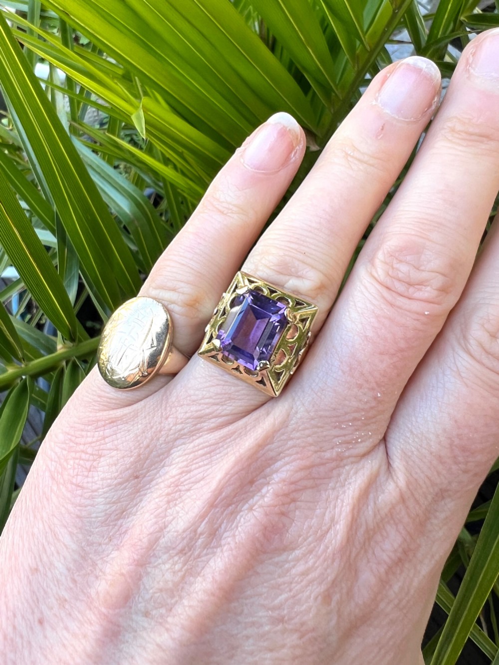A vintage 14-carat yellow gold cocktail ring featuring a rectangular emerald-cut amethyst set in a raised geometric openwork gallery. View VII