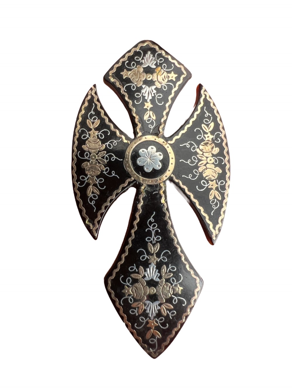 A Victorian cross brooch crafted from dark tortoiseshell with gold and silver pique floral inlays. View VII