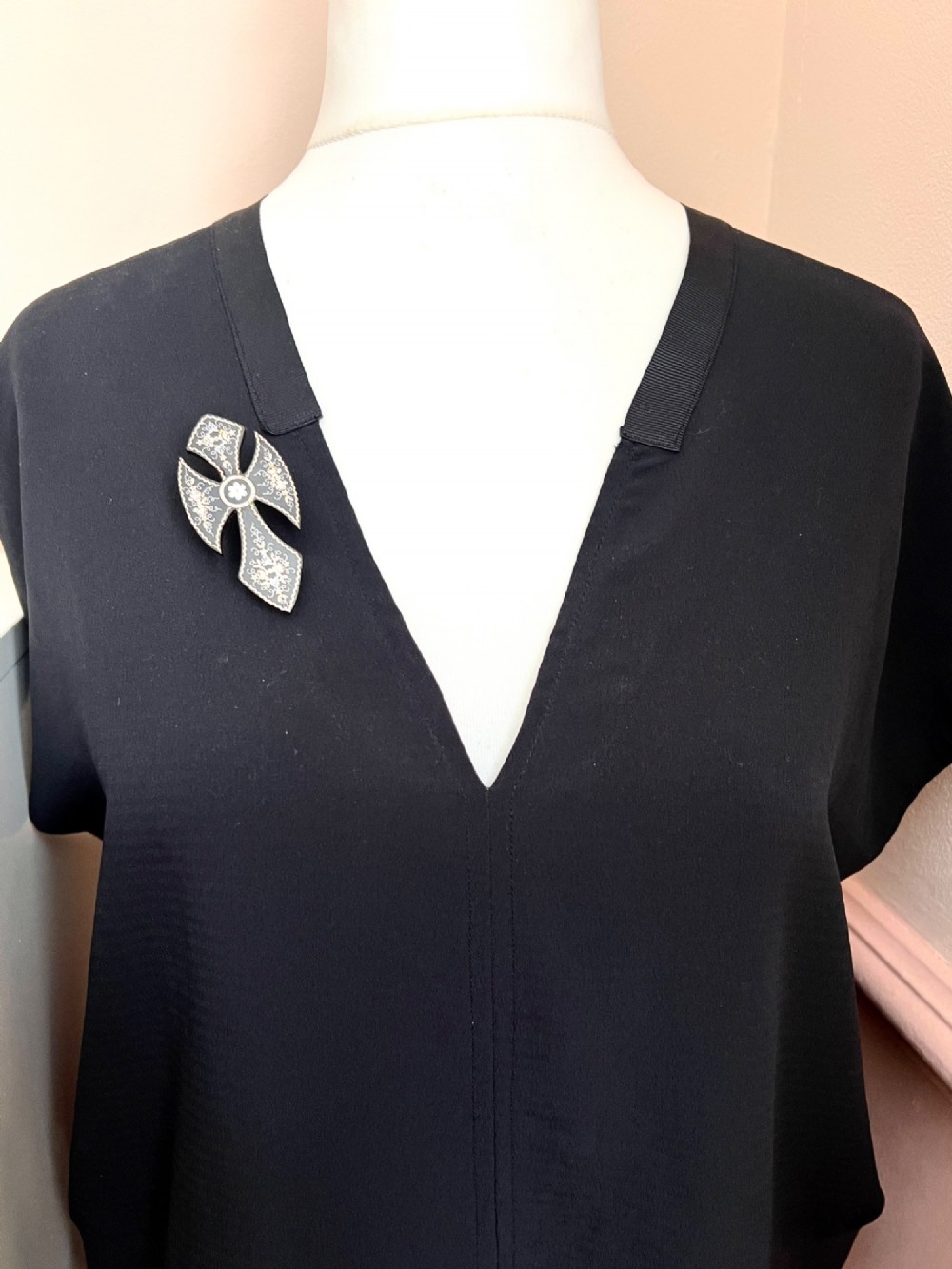 A Victorian cross brooch crafted from dark tortoiseshell with gold and silver pique floral inlays. View IX