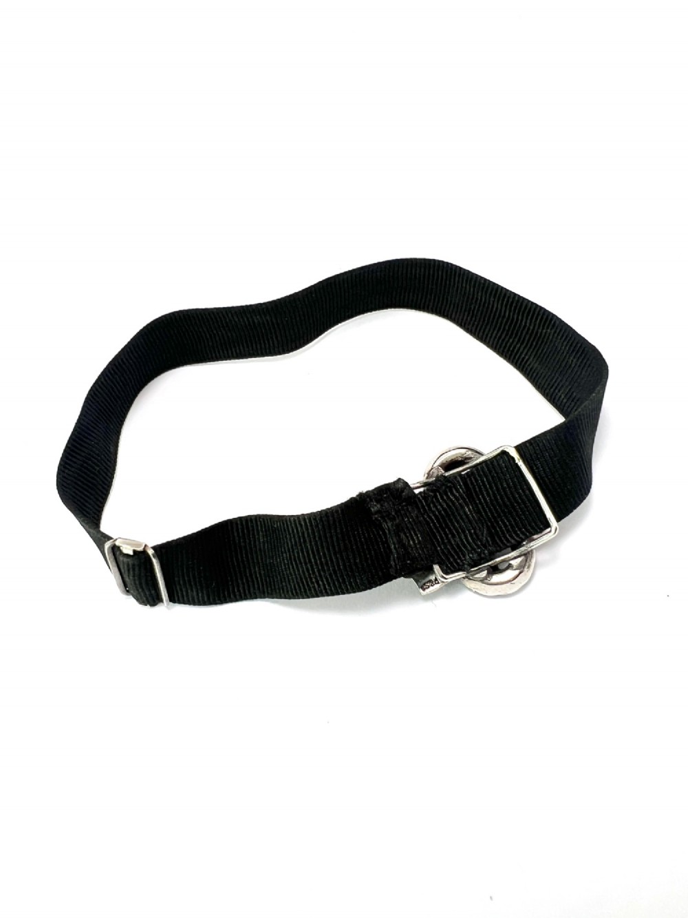 An antique silver ribbon slider bracelet featuring a star-shaped paste central motif on a black grosgrain ribbon. View V