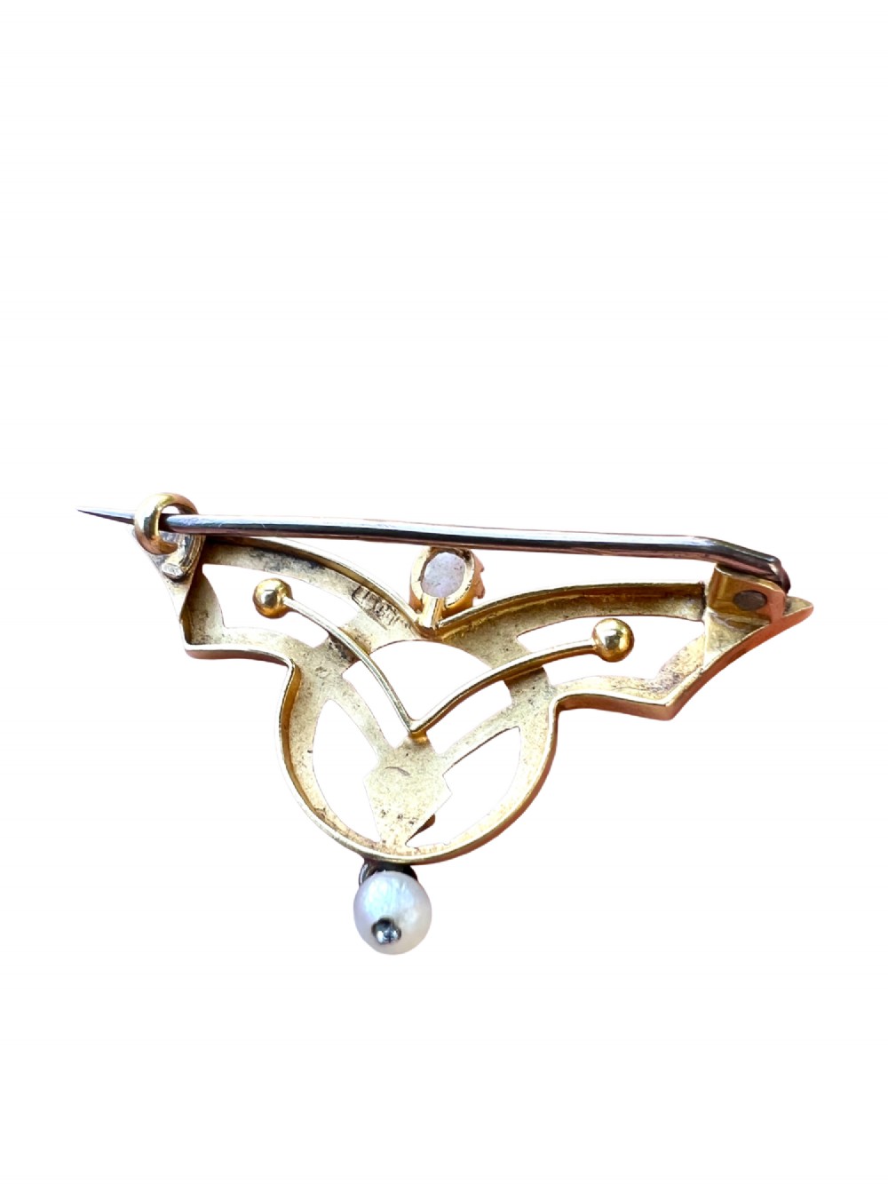 An Art Nouveau 18ct gold openwork brooch featuring a claw-set central opal, a red ruby, and a dangling pearl drop. View III